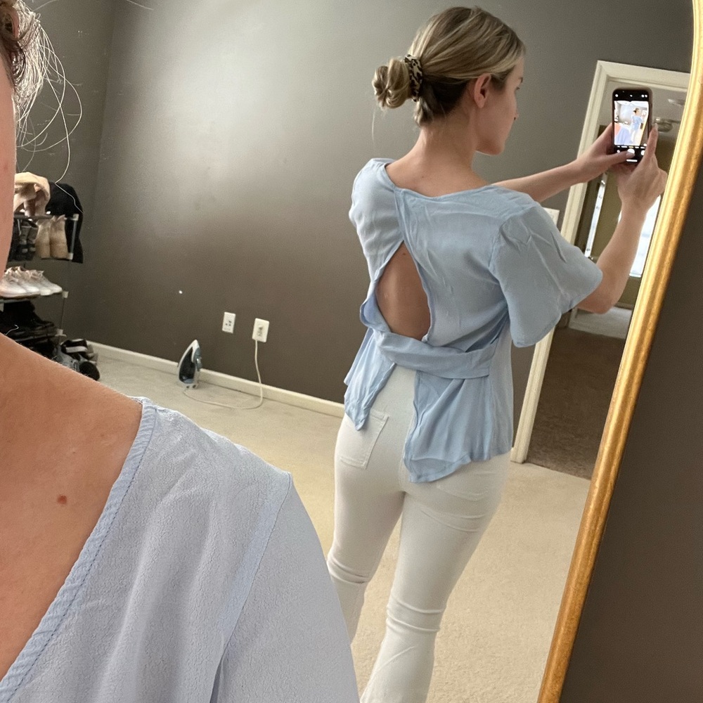 Sky blue flowy shirt with open back. Size small